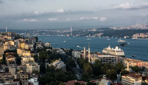 Panoramic sunset view on bridge and cruise ship in Istanbul augst summer Stock Photos