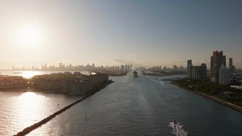 Panoramic Sunset View of Cruise Ship, Miami Skyline, and Tropical Waterfront Stock Footage 315290662