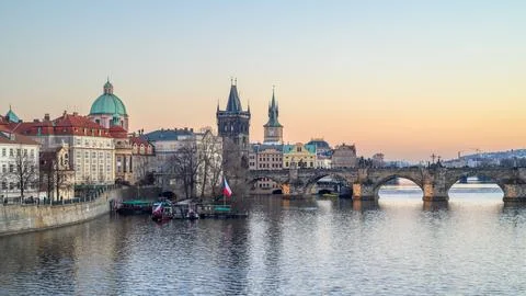 Panoramic sunset view of the iconic Charles Bridge over Vltava river and Pr.. Stock Photos