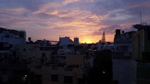 A panoramic sunset view over urban skyline beneath pink and blue sky likely.. 스톡 동영상 325762652