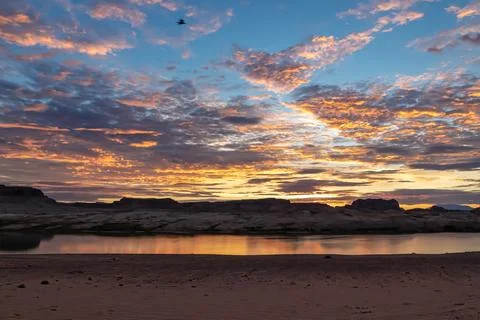 Panoramic sunset view seen from Lone Rock Beach in Wahweap Bay in Lake Powe.. Stock Photos
