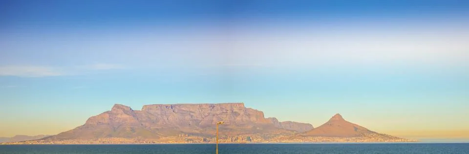 Panoramic Table Mountain behind Atlantic ocean cape town Stock Photos