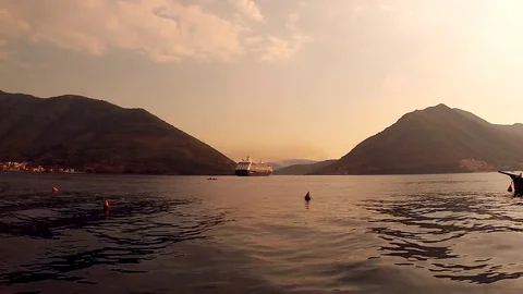 Panoramic time lapse of sea horizon with mountains during sunset. Stock Footage 80245258