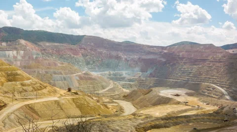 Panoramic time-lapse of trucks and excavators in giant open pit mine Stock Footage 57696918