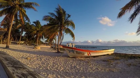 Panoramic timelapse in Mexico, Punta Allen at sunrise beach boat palm trees sea Stock Footage 74250190
