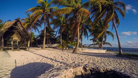 Panoramic timelapse in Mexico, Punta Allen at sunrise beach boat palm trees sand Stock Footage 74250292