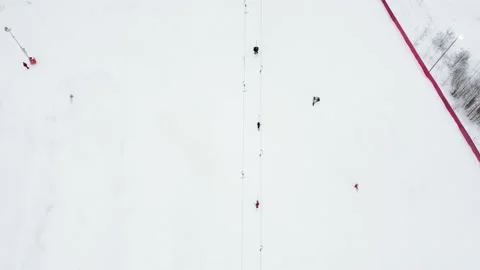 Panoramic top view from drone on cable way in ski resort. Ski lift elevator Vídeo Stock 162464098