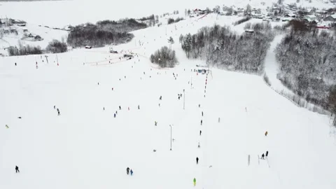 Panoramic top view from drone on cable way in ski resort. Ski lift elevator Vídeo Stock 163159465