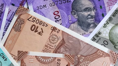 Panoramic top view of Indian banknotes of 10, 50, 100 and 500 rupees. Stock Footage 302582132