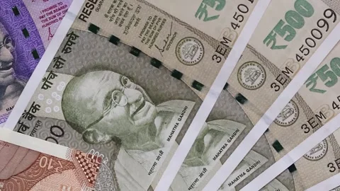 Panoramic top view of Indian banknotes of 10, 50, 100 and 500 rupees. Stock Footage 302582135