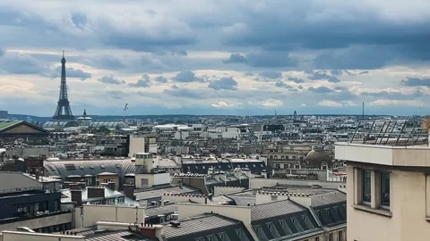 Panoramic top view of Paris, rooftops, Eiffel Tower and cloudy sky. Stock Footage 311939664