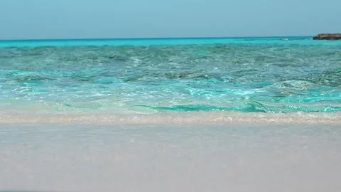 A panoramic tropical landscape captures crashing blue ocean waves  Stock Footage 329141373