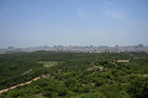 Panoramic Urban Skyline with Dense Tree Canopy and Modern Cityscape Stock Photos