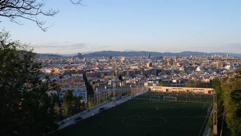 Panoramic video of Barcelona with municipal soccer field in the foreground Stock Footage