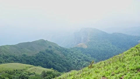 A panoramic video of beautiful mountains surrounded by lush, dense forest d.. Stock Footage 313381109