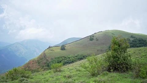 A panoramic video of beautiful mountains surrounded by lush, dense forest d.. Stock Footage 313381120