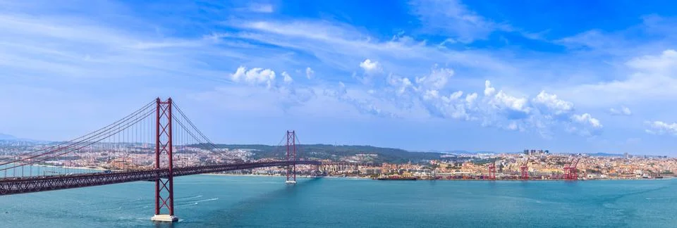 Panoramic view of 25 de Abril Bridge over Tagus river in Lisbon Portugal with Stock Photos
