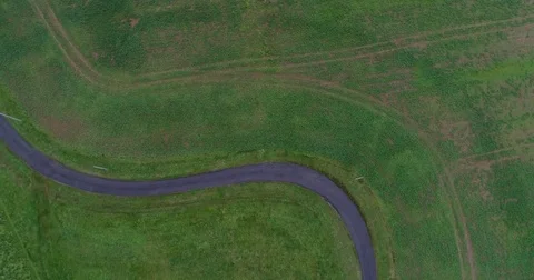Panoramic View From Above On Meadows  and Countryside road Stock Footage 83064878