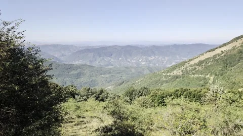 Panoramic view from above over a valley and the mountains Stock Footage 344968026
