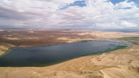 Panoramic view from above on a sandy desert with lakes. Stock Footage 93870550