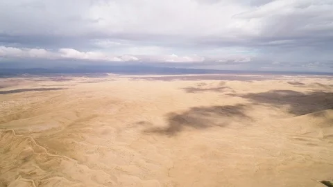 Panoramic view from above on a sandy desert with lakes. Stock Footage 93870620
