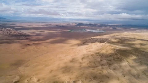 Panoramic view from above on a sandy desert with lakes. Stock Footage 93870624