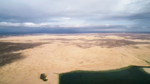Panoramic view from above on a sandy desert with lakes. Stock Footage 93870638