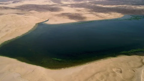 Panoramic view from above on a sandy desert with lakes. Stock Footage 93870646