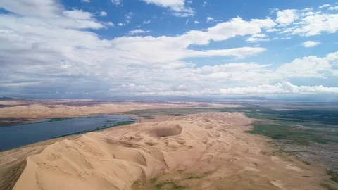 Panoramic view from above on a sandy desert with lakes. Stock Footage 93870747