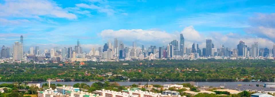 Panoramic view of actively developing area metropolis with large natural isla Stock Photos