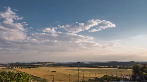 Panoramic view of an agricultural field in spring season. time lapse sunset Video stock 77095817
