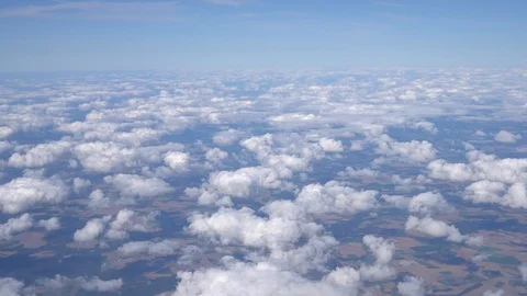 Panoramic view from the airplane window. Flying over beautiful clouds. Ultra HD Stock-Footage 121878299