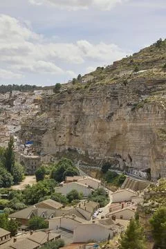 Panoramic view of Alcala del Jucar village and cliffs in Spain Stock Photos