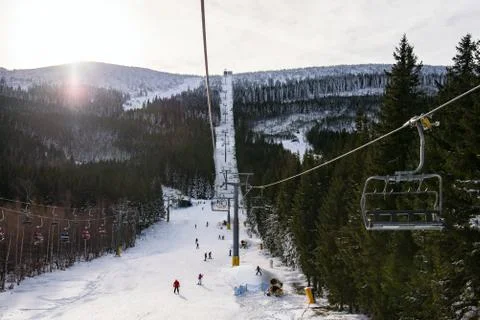 Panoramic view of an alpine mountainside with ski lift Stock Photos