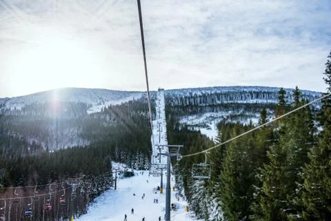 Panoramic view of an alpine mountainside with ski lift Stock Photos