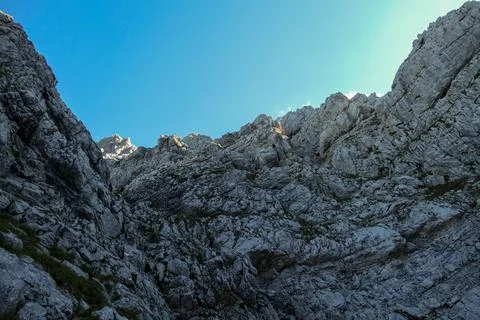 A panoramic view on Alpine slopes in Austria with sharp ans steep mountains Stock Photos