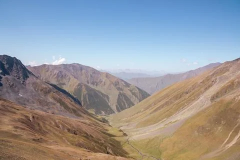 Panoramic view on a alpine terrain seen from the Chaukhi Pass in the Greate.. Stock Photos