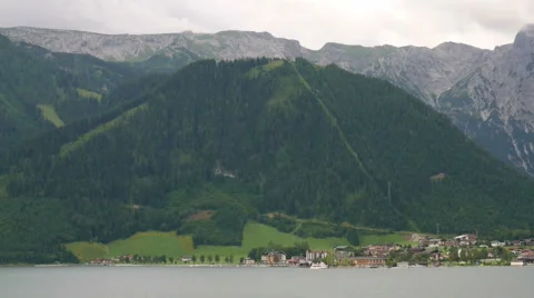 Panoramic view of alpine village on the mountain lake, Italy Stock Footage 65365679