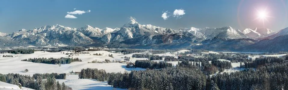 Panoramic view to alps mountain range in Bavaria at winter Stock Photos