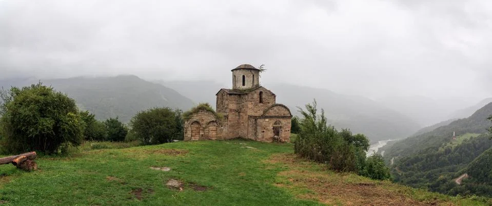 Panoramic view of an ancient monastery on top of a mountain in the Caucasus i Stock Photos