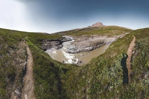 Panoramic view of arctic landscape of Disko Bay in Greeland in Summer. Blue Sky Stock Photos