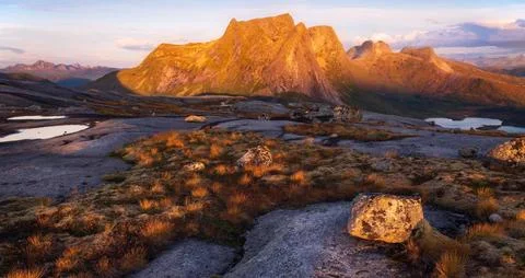 Panoramic View of Arctic Mountain Range at Dusk Stock Photos