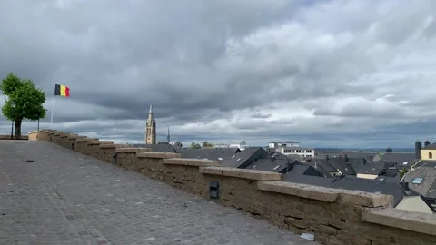 Panoramic view of Arlon city rooftops. St Martin church. Belgian flag. Belgium Stock Footage 307496052