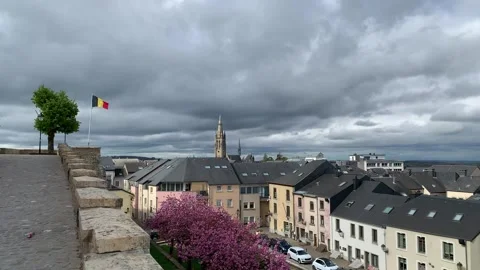 Panoramic view of Arlon city rooftops. St Martin church. Belgian flag. Belgium Stock Footage 307496057