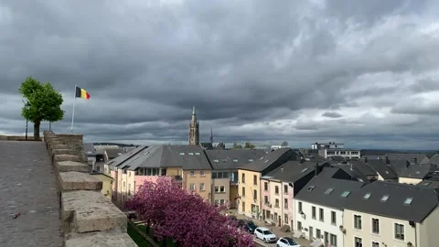 Panoramic view of Arlon city rooftops. St Martin church. Belgian flag. Belgium Stock Footage 307498361
