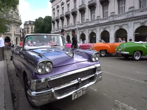 Panoramic view around old bright violet retro car in the parking zone at central Stock Footage 70918253