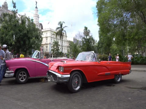 Panoramic view around old colorful bright retro cars in the parking zone at Stock Footage 70917583