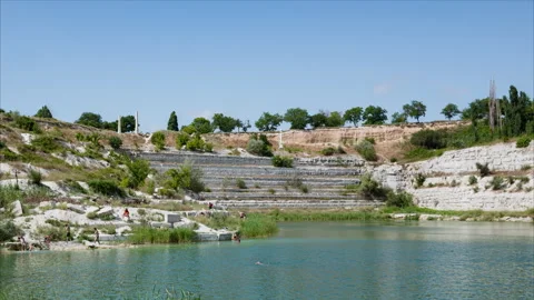 Panoramic view to artificial reservoir full of warm turquoise water Stock-Footage 241747309