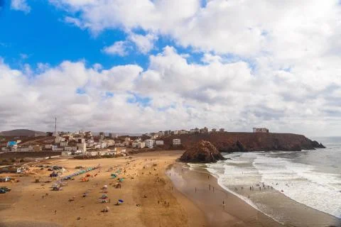 Panoramic view on Atlantic ocean beach in small Morrocan town Iguer Ouzrou Stock Photos