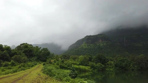 Panoramic view of the backwaters of Solanpada Dam Stock Footage 141129391